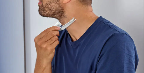 Man using Scholl Freeze Away Skin Tag Remover on his neck